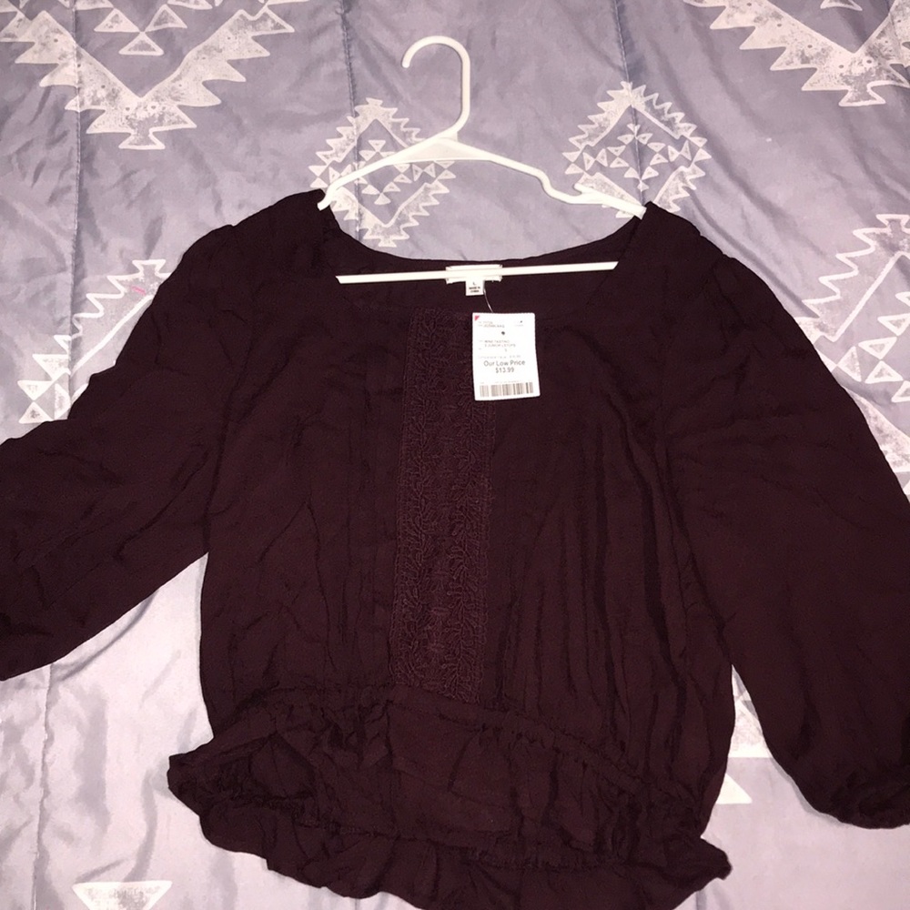 A shirt that’s maroon with price tags!